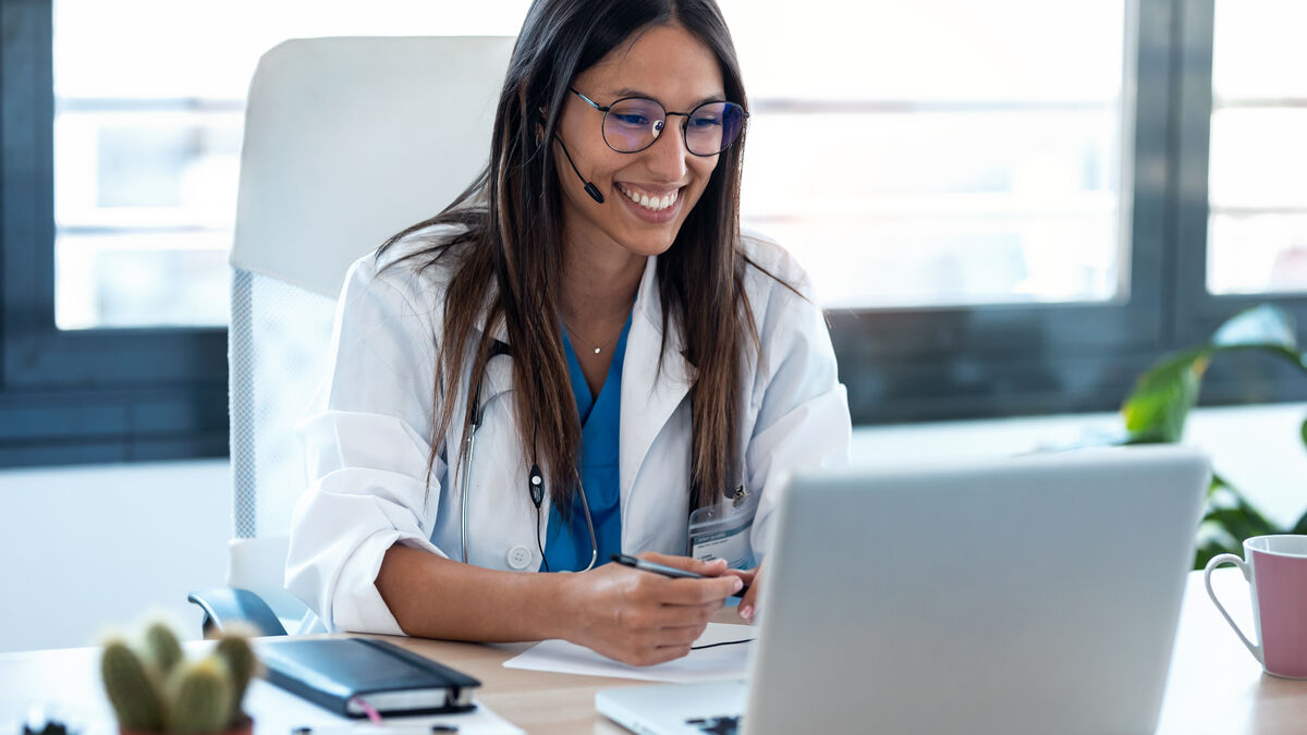 Female doctor talking with colleagues through a vi 2022 12 15 18 17 16 utc