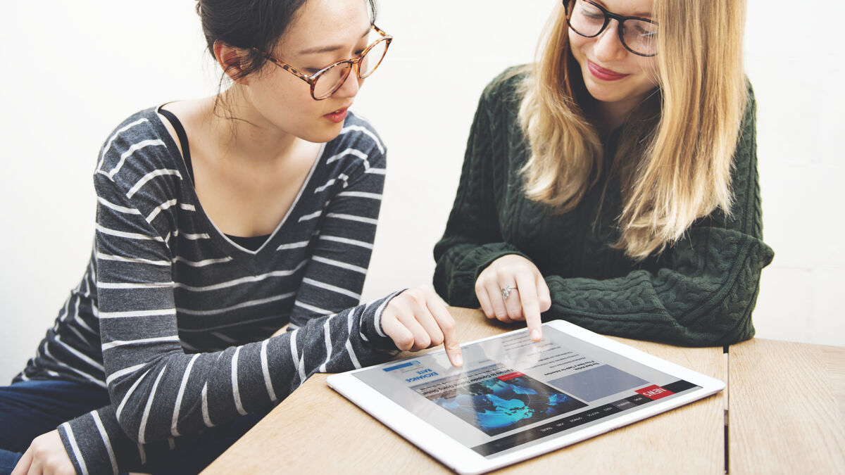 Women friendship digital tablet news networking co 2022 12 15 23 49 44 utc